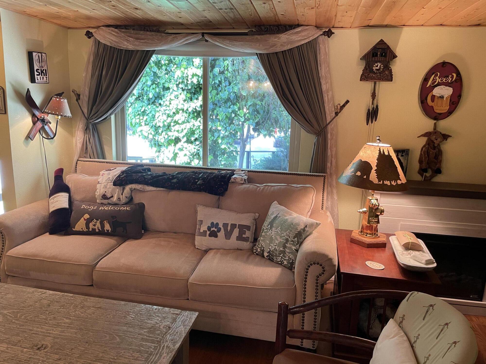 38540 Alva Drive Cherry Valley, CA 92223 - Photo 32 of 60 a living room with furniture a fireplace and a window