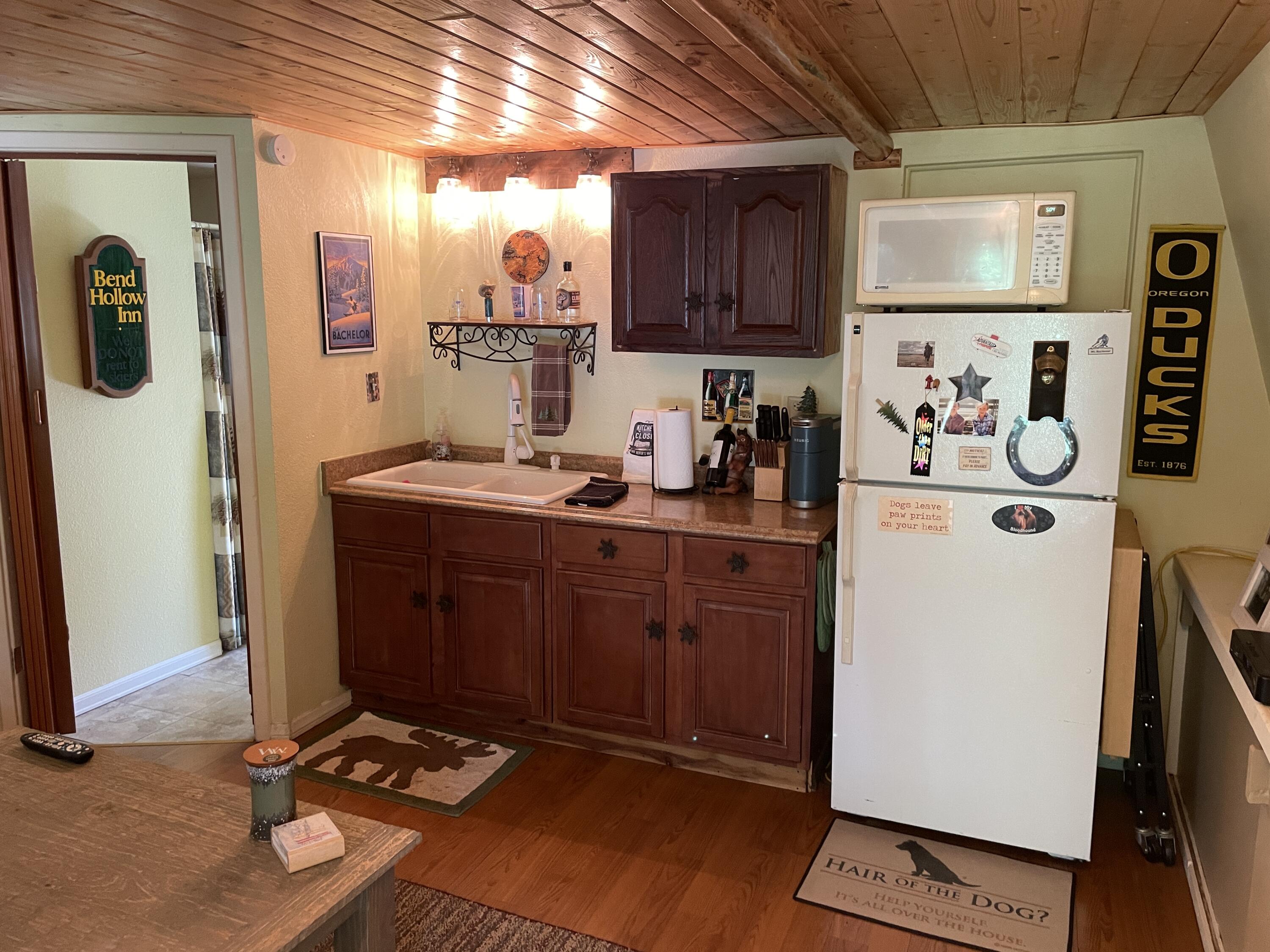 38540 Alva Drive Cherry Valley, CA 92223 - Photo 34 of 60 a view of a kitchen with fridge and workspace