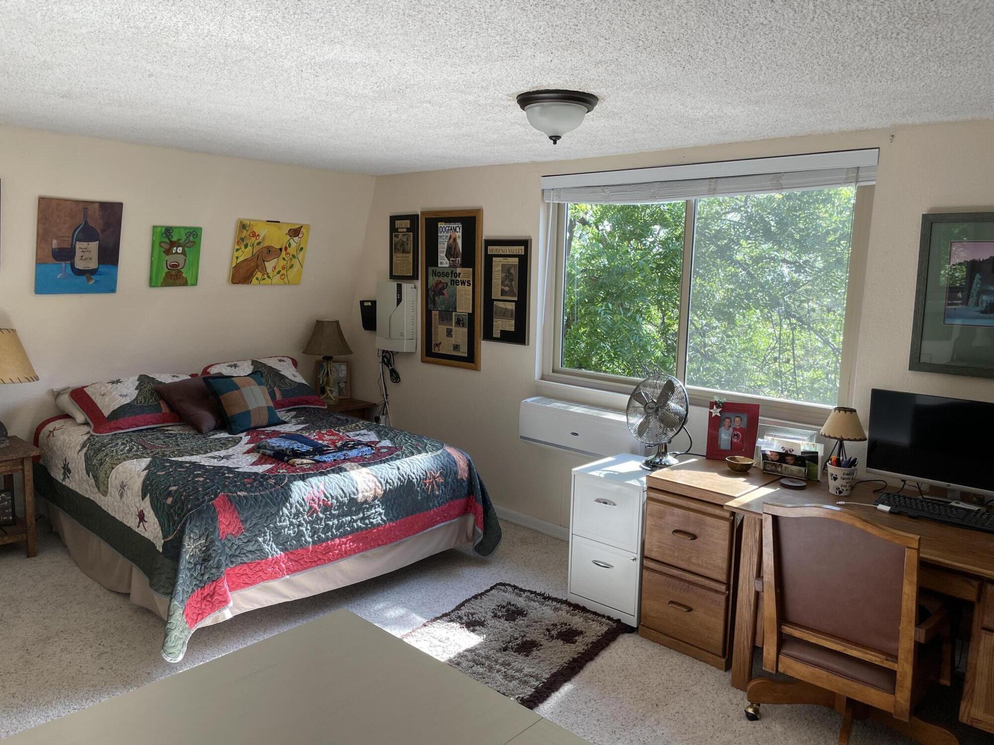 38540 Alva Drive Cherry Valley, CA 92223 - Photo 35 of 60 a bedroom with a bed and a window