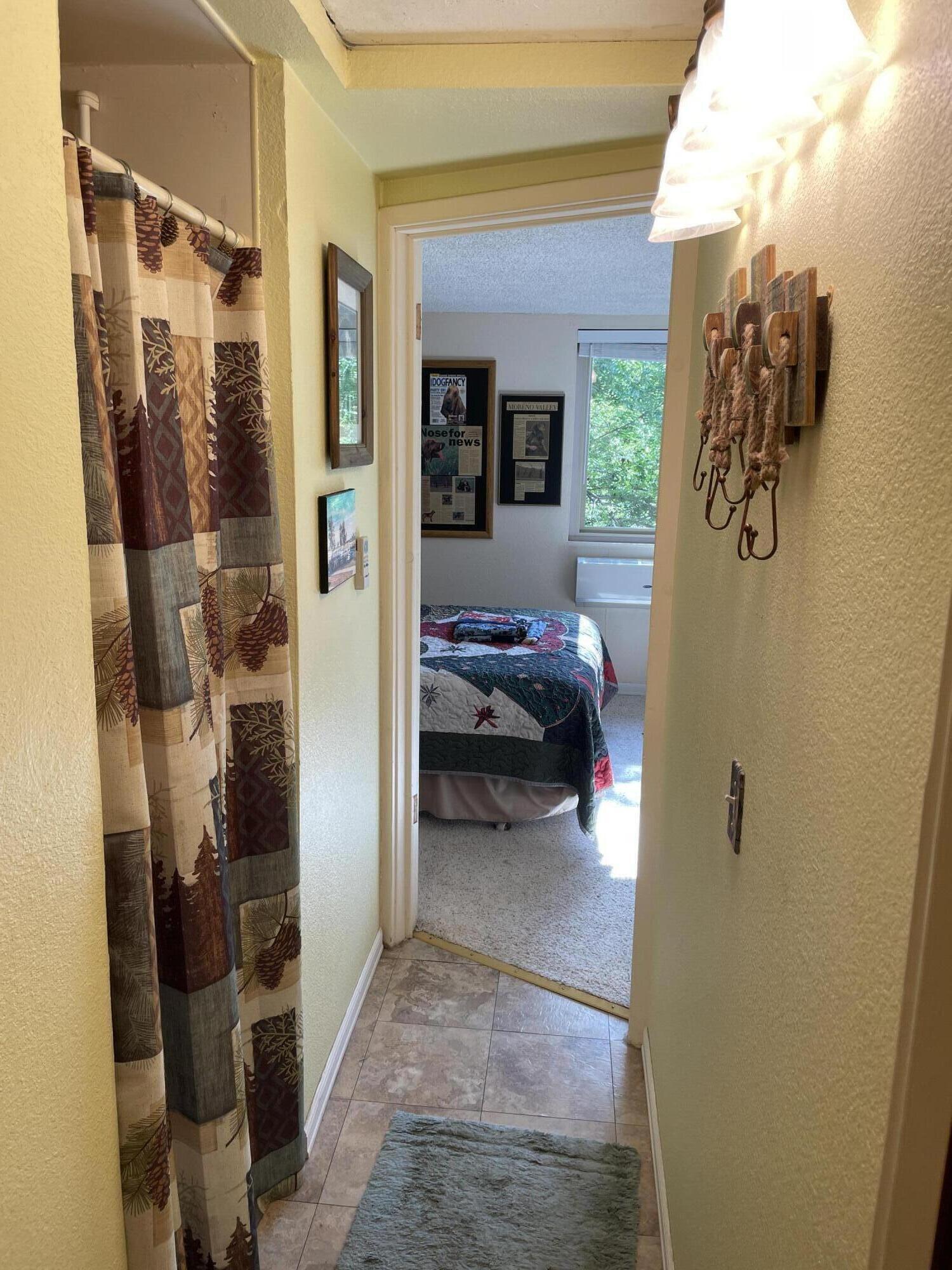 38540 Alva Drive Cherry Valley, CA 92223 - Photo 37 of 60 a view of a bedroom from a hallway