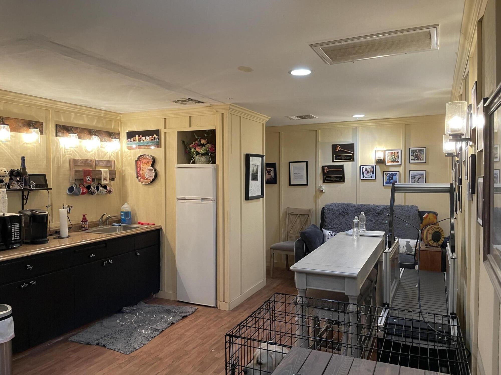 38540 Alva Drive Cherry Valley, CA 92223 - Photo 39 of 60 a kitchen with stainless steel appliances kitchen island granite countertop a refrigerator and cabinets