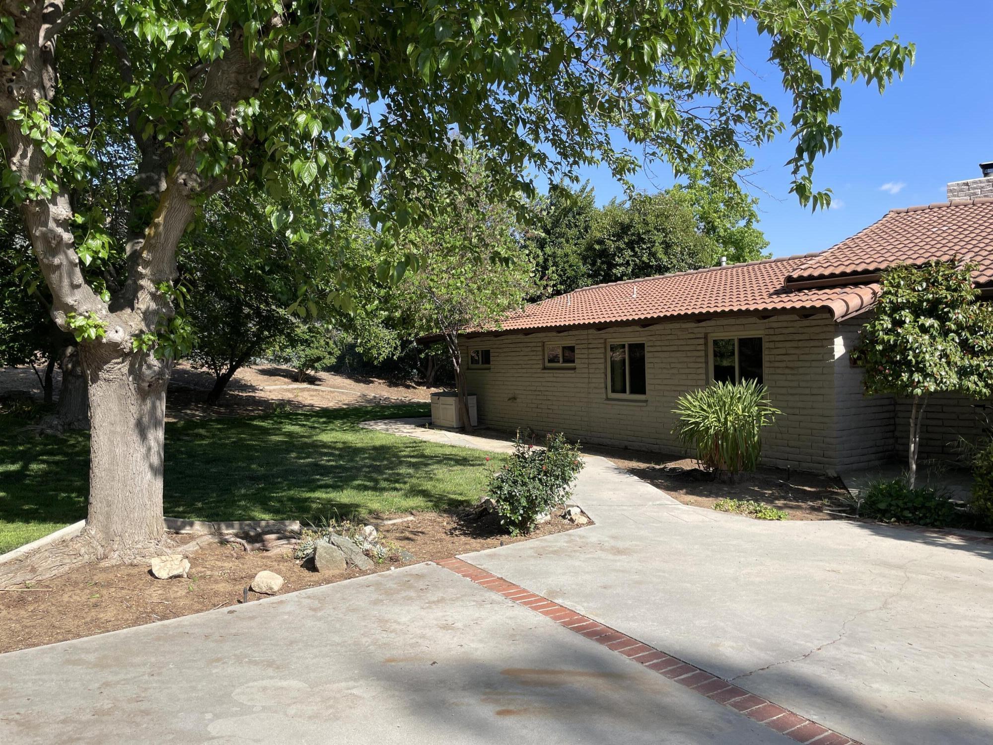 38540 Alva Drive Cherry Valley, CA 92223 - Photo 4 of 60 a front view of a house with a garden