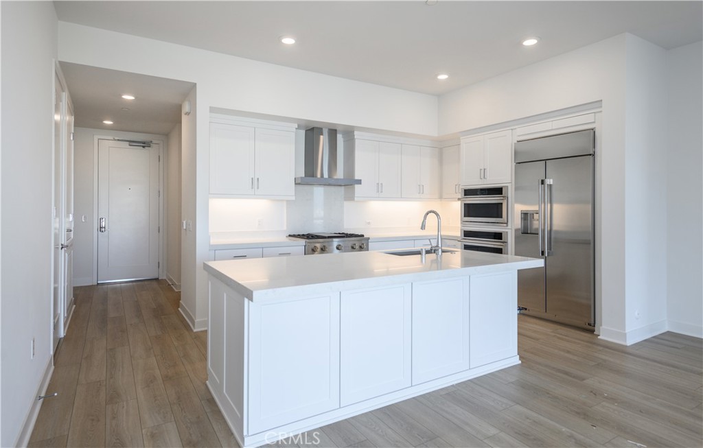 3608 Rivington Irvine, CA 92612 - Photo 15 of 74 a kitchen with stainless steel appliances granite countertop a refrigerator a sink and a stove