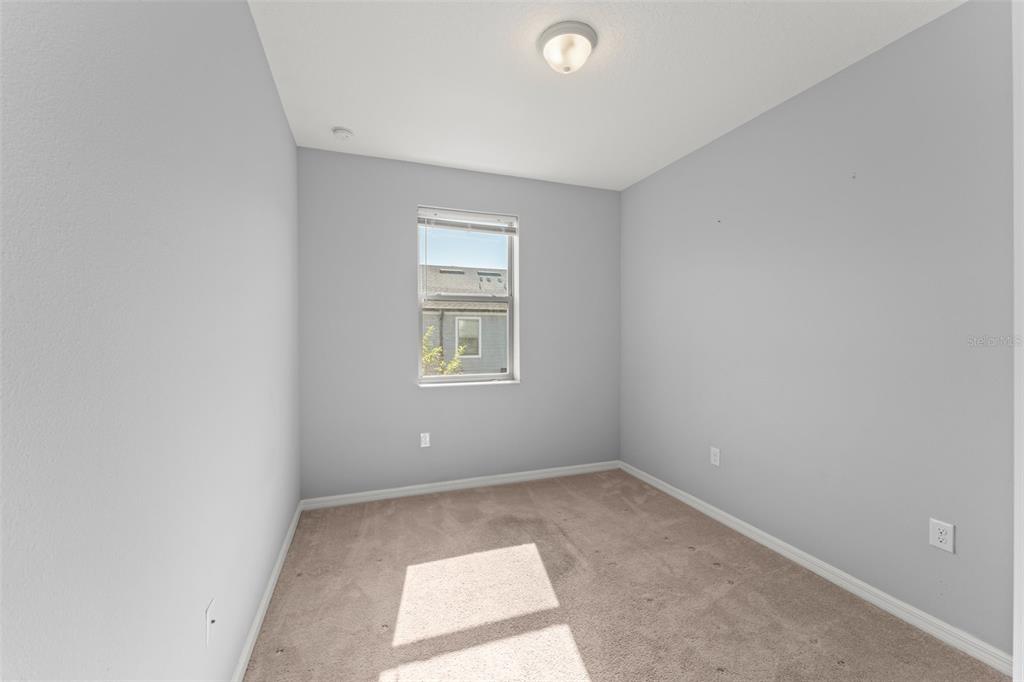 229 Rustic Loop Sanford, FL 32771 - Photo 21 of 38 an empty room with a window