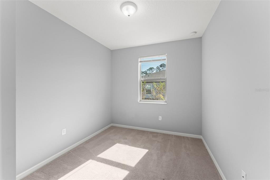 229 Rustic Loop Sanford, FL 32771 - Photo 23 of 38 an empty room with windows