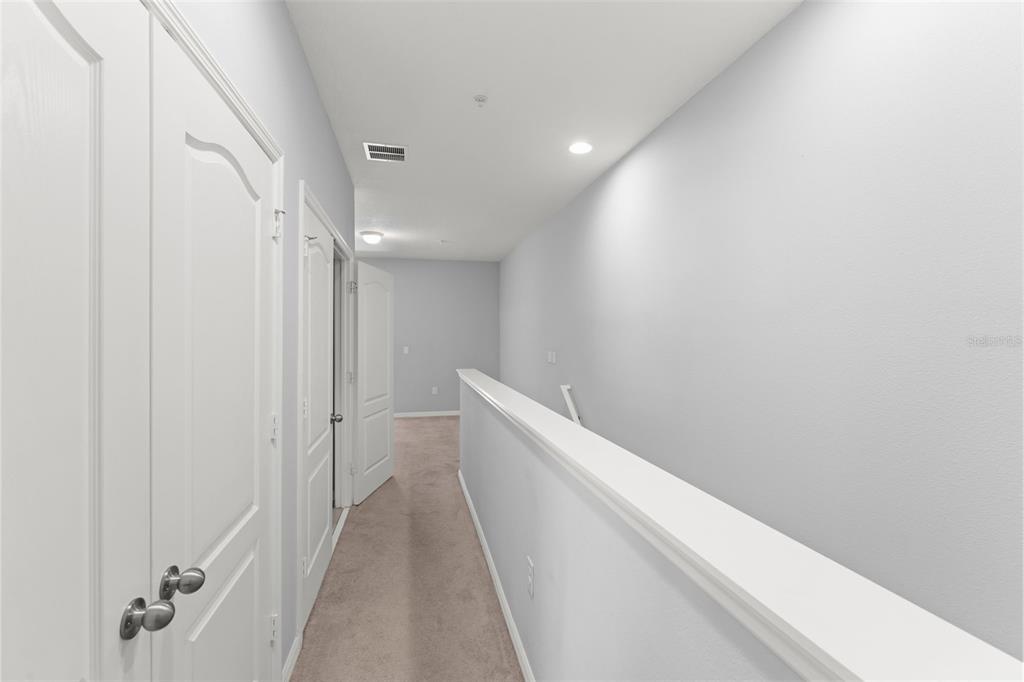 229 Rustic Loop Sanford, FL 32771 - Photo 27 of 38 a view of hallway with closet