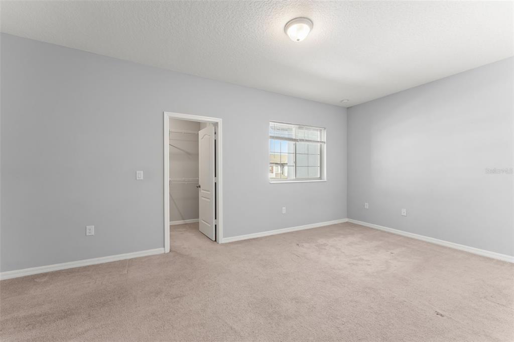 229 Rustic Loop Sanford, FL 32771 - Photo 28 of 38 an empty room with windows
