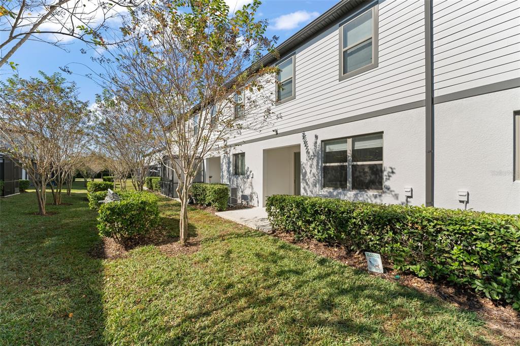 229 Rustic Loop Sanford, FL 32771 - Photo 36 of 38 a view of a house with backyard and sitting area