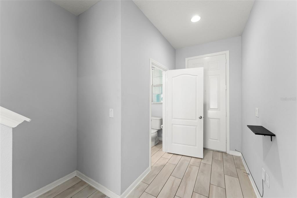 229 Rustic Loop Sanford, FL 32771 - Photo 4 of 38 a view of empty room with wooden floor