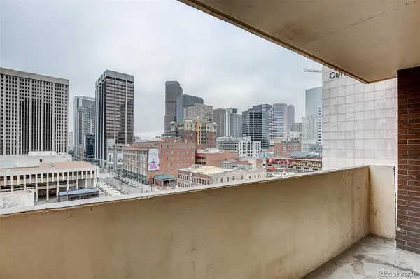 a view of a balcony with city view