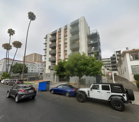 a view of cars parked in front of a building
