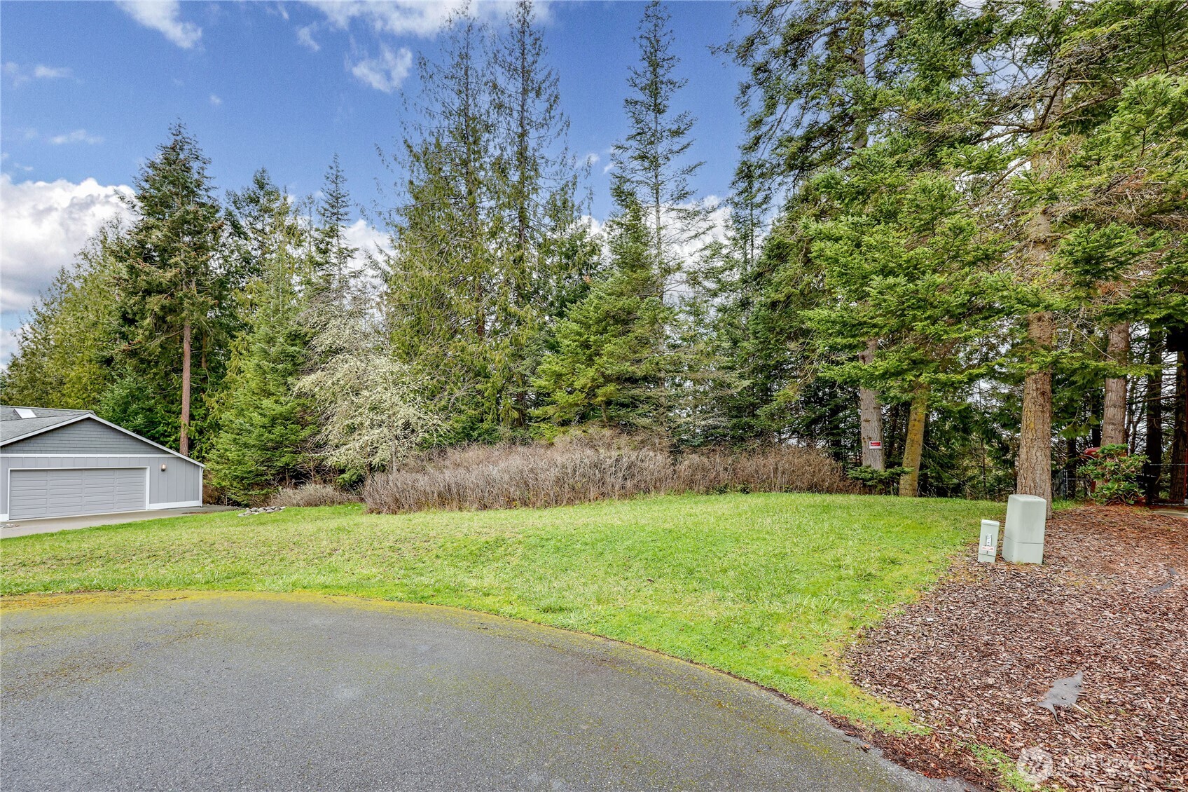 0 Vancouver Place Sequim, WA 98382 - Photo 1 of 26 a view of a house with a yard and tree s