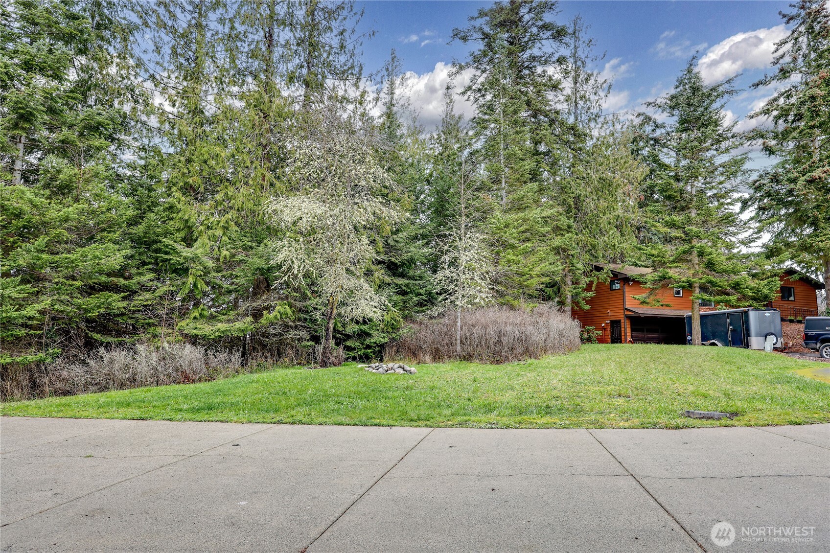 0 Vancouver Place Sequim, WA 98382 - Photo 2 of 26 a view of a house with a yard and a garden