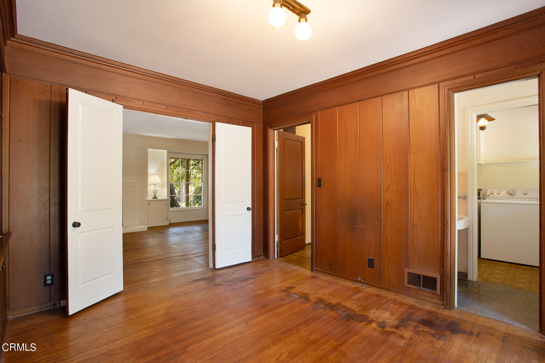 1647 Braeburn Road Altadena, CA 91001 - Photo 21 of 48 an empty room with wooden floor and windows