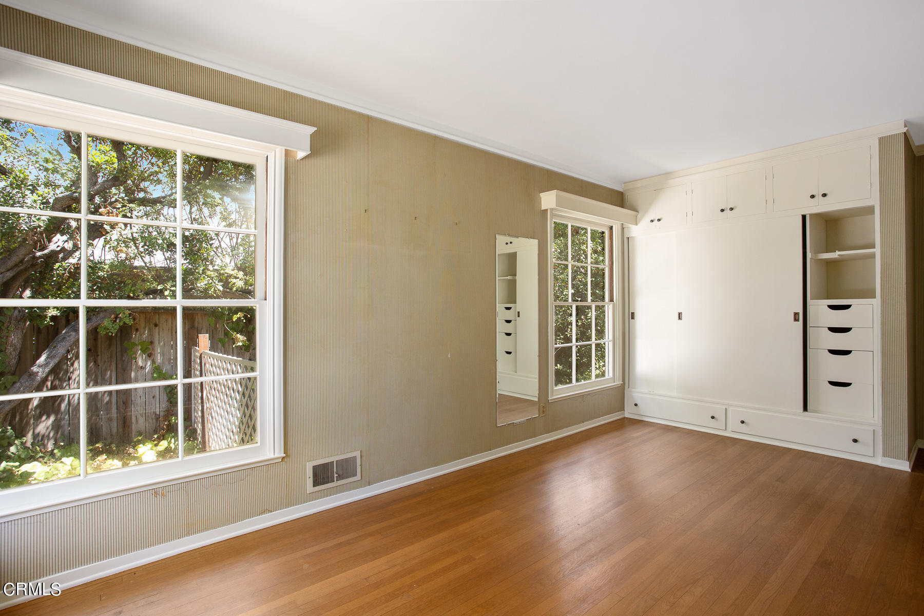 1647 Braeburn Road Altadena, CA 91001 - Photo 28 of 48 an empty room with wooden floor and windows