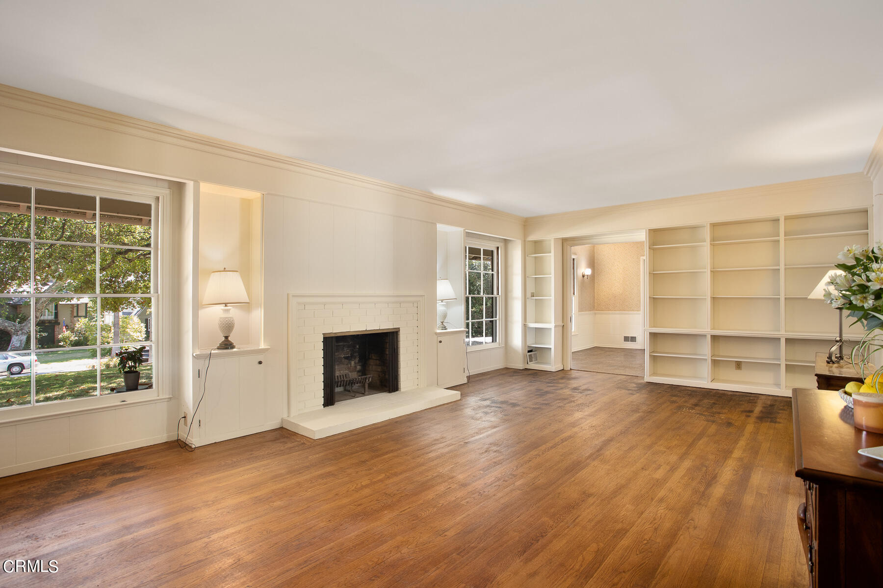 1647 Braeburn Road Altadena, CA 91001 - Photo 9 of 48 a view of a livingroom with wooden floor a fireplace and windows