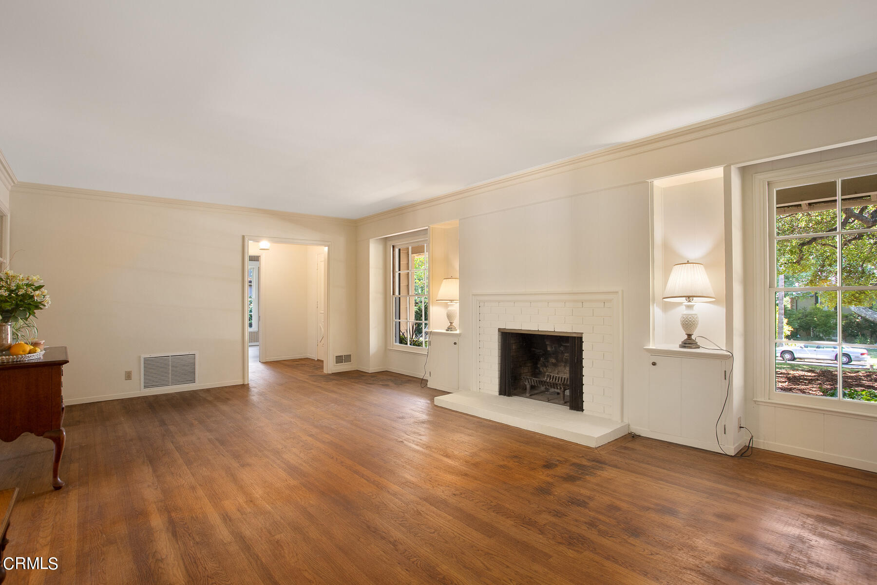 1647 Braeburn Road Altadena, CA 91001 - Photo 10 of 48 an empty room with furniture and a fireplace