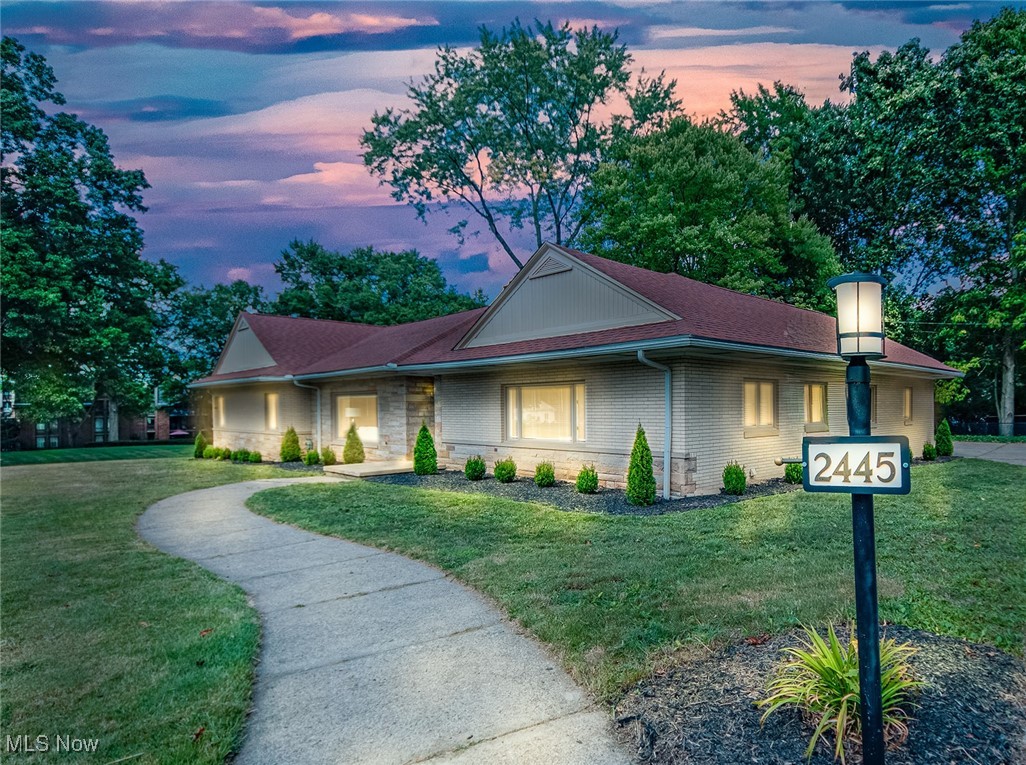 2445 Chatham Road Akron, OH 44313 - Photo 1 of 32 Warm and welcoming twilight view of the exterior view of this cozy, three bedroom brick ranch on a beautiful corner lot in Fairlawn Hts!