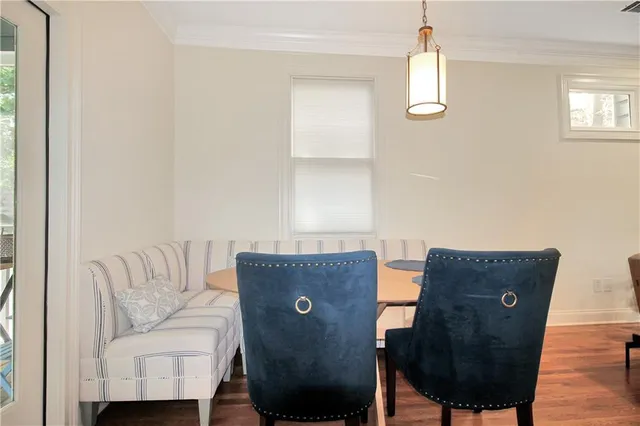 a large kitchen with stainless steel appliances kitchen island granite countertop a large cabinets a sink and a stove