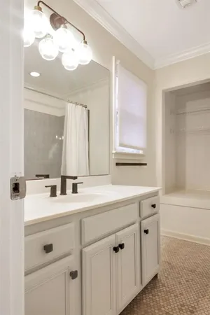 a bathroom with a double vanity sink mirror and
