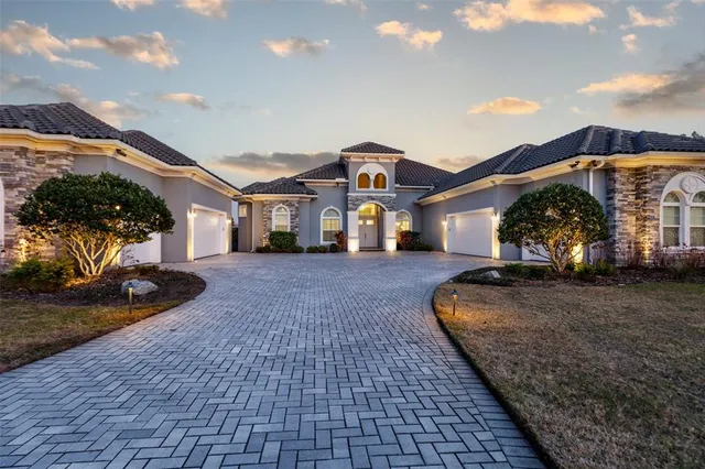 a living room with furniture fireplace and a table