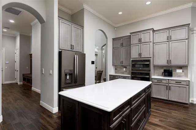 a bathroom with a double vanity sink and mirror