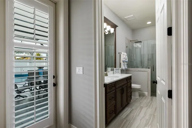 a bedroom with bed and window