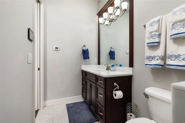 a kitchen with a refrigerator and a sink