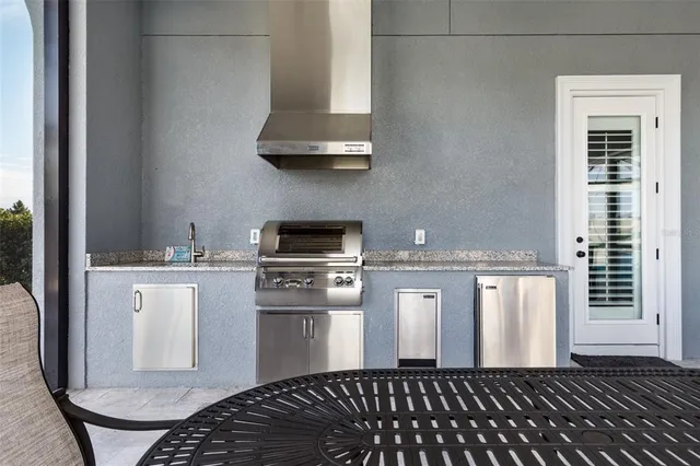 a view of a hallway with wooden floor and a living room