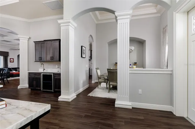 a kitchen with stainless steel appliances a refrigerator sink and cabinets