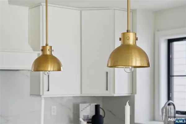 a kitchen with a sink cabinets and appliances