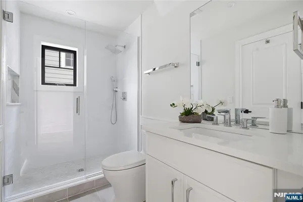 a bedroom with a bed and a table