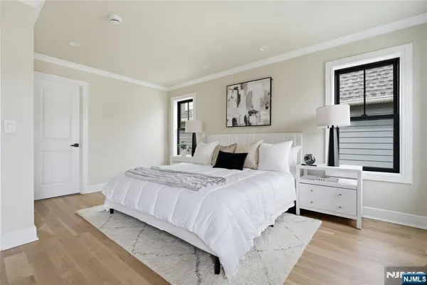 a bedroom with a bed and a lamp