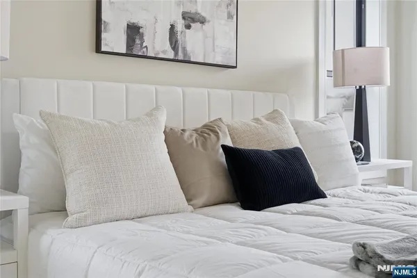 a bathroom with a double vanity sink mirror and shower