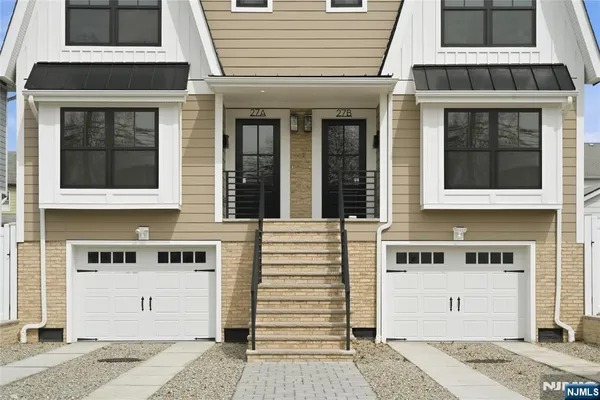 a front view of a house with a large window