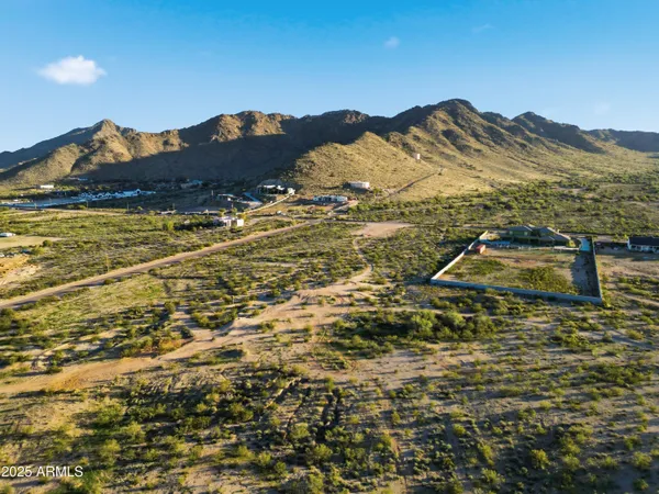 a view of a town with mountains in the background