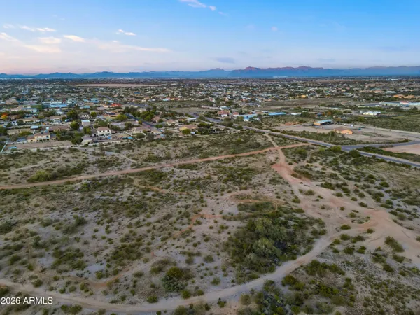 a view of a city with mountains in the background