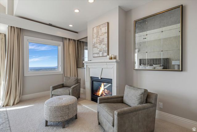 3222 Eagle View Circle Sandy, UT 84092 - Photo 20 of 60 Sitting room featuring carpet floors, a glass covered fireplace, and recessed lighting
