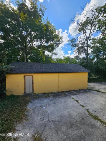 a view of outdoor space with outside kitchen