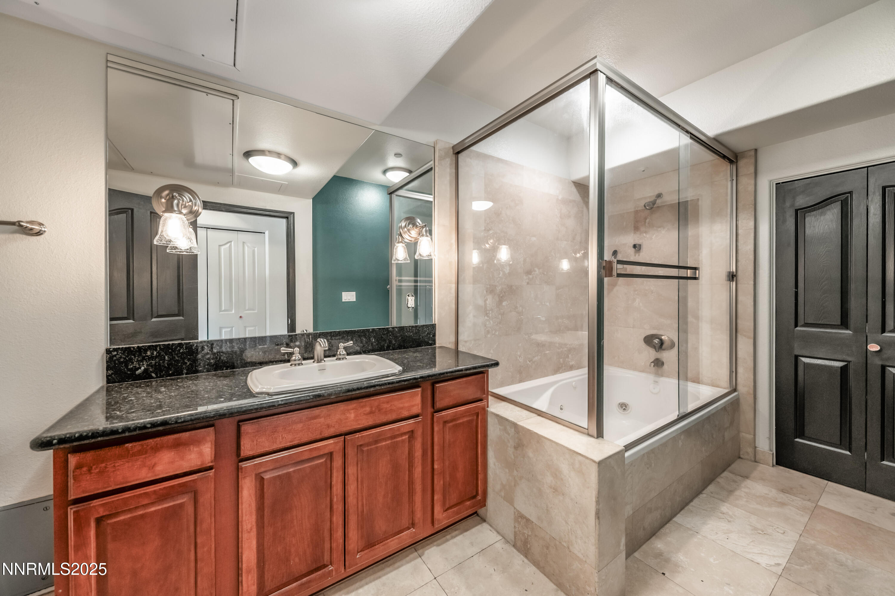 200 West 2nd Street, Unit 1101 Reno, NV 89501 - Photo 20 of 38 a bathroom with a sink mirror and a bathtub