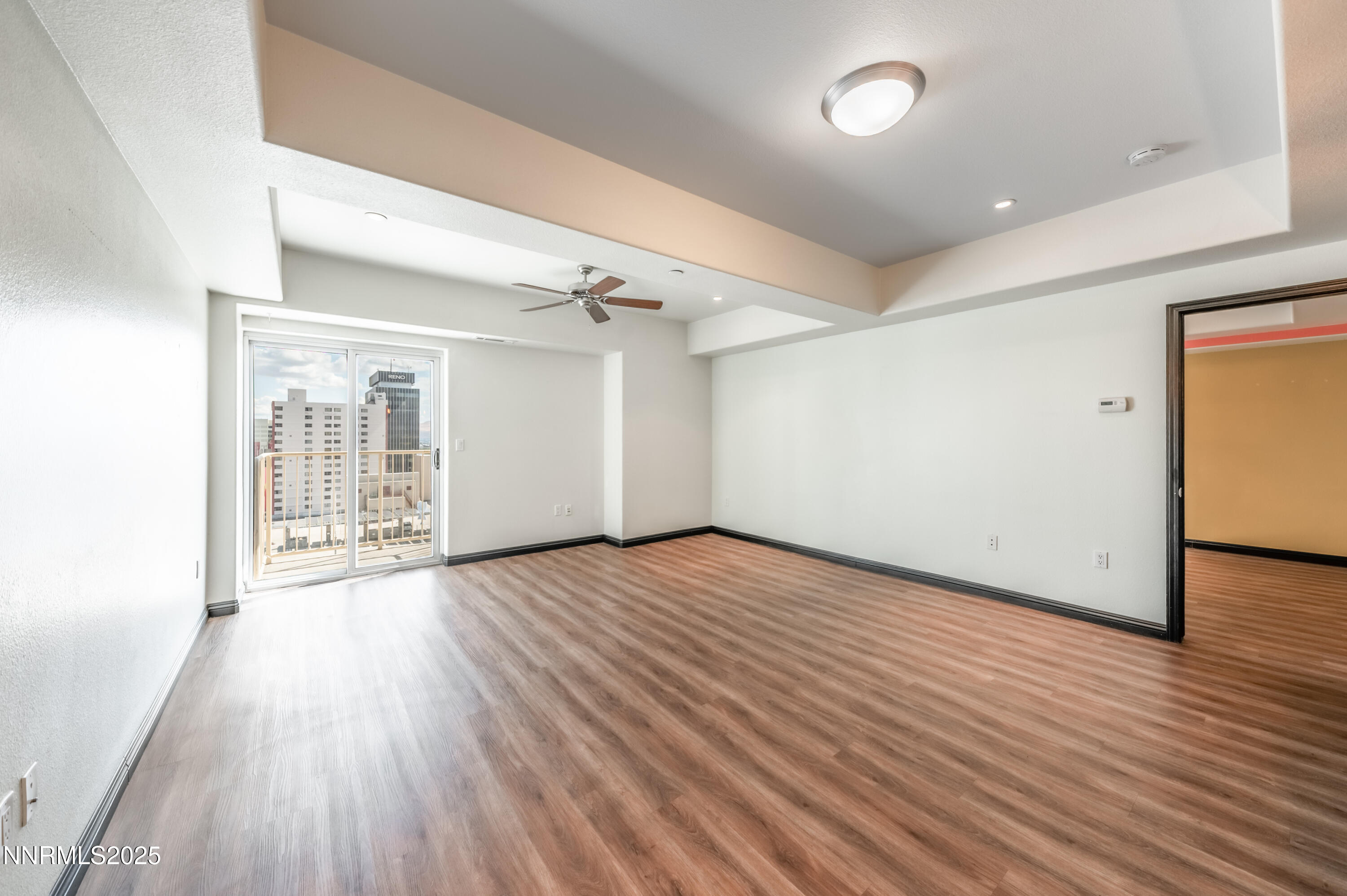 200 West 2nd Street, Unit 1101 Reno, NV 89501 - Photo 6 of 38 wooden floor in an empty room with a window