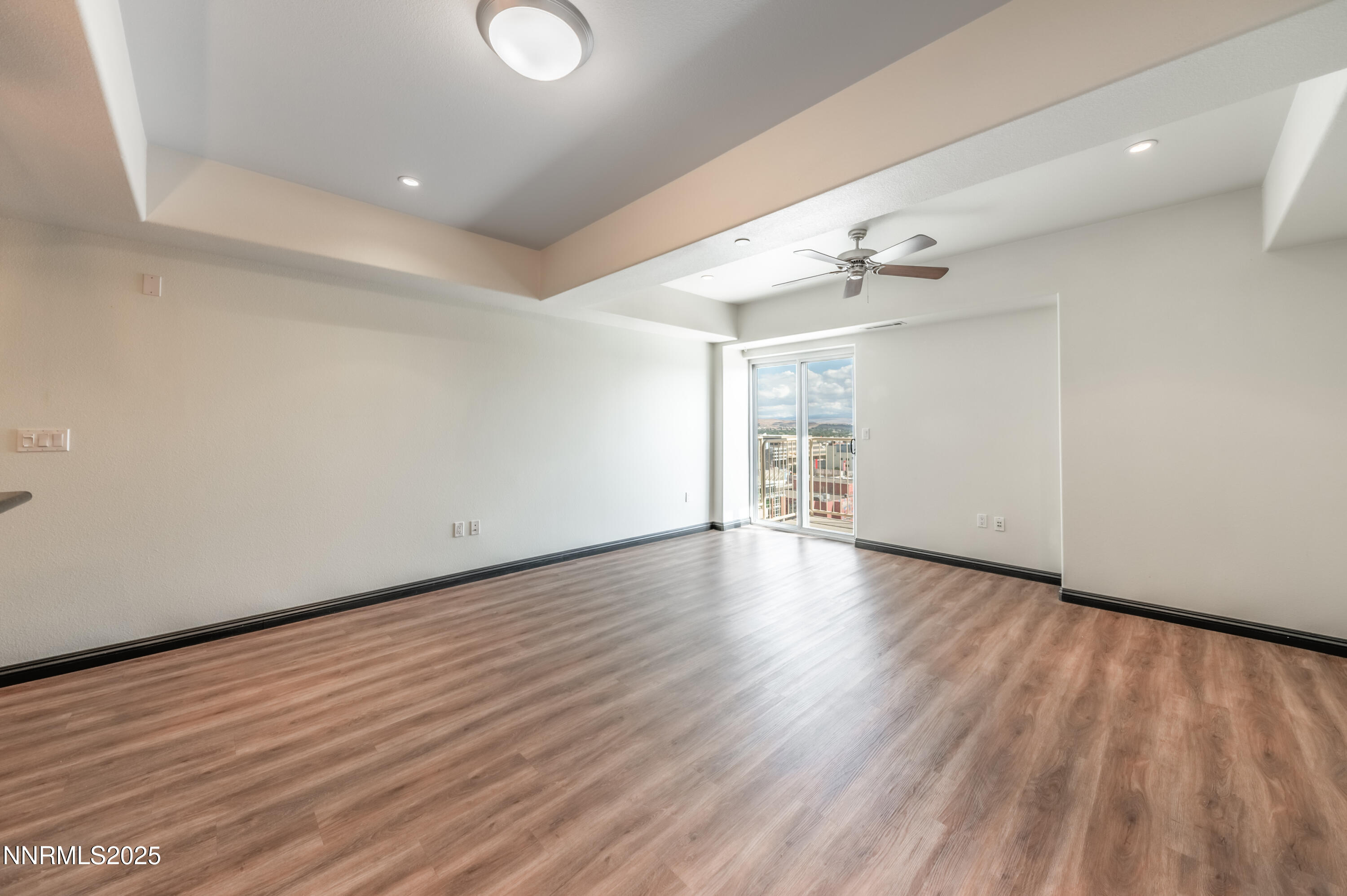 200 West 2nd Street, Unit 1101 Reno, NV 89501 - Photo 7 of 38 wooden floor in an empty room with a window
