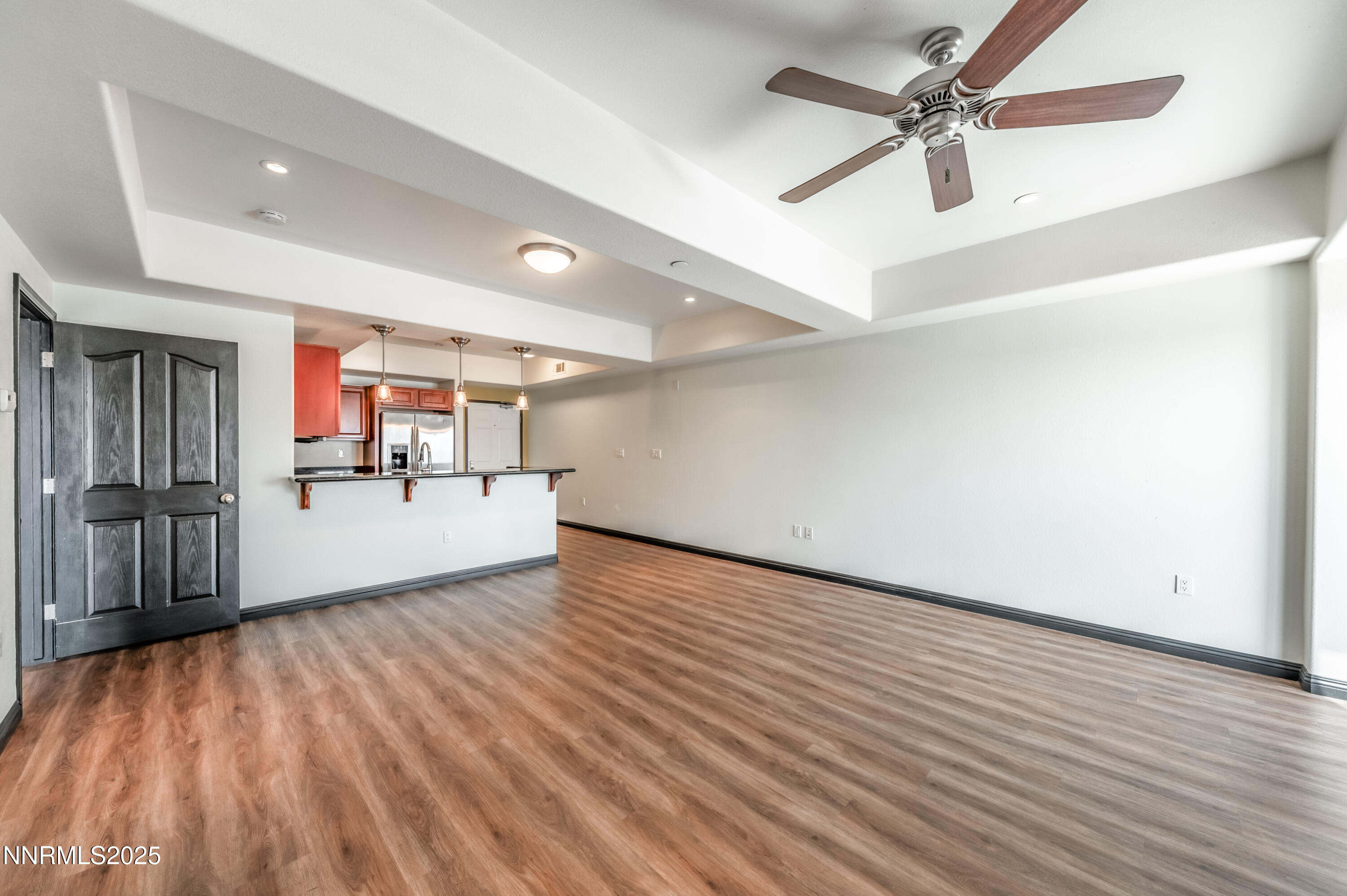 200 West 2nd Street, Unit 1101 Reno, NV 89501 - Photo 8 of 38 wooden floor in an empty room with a window