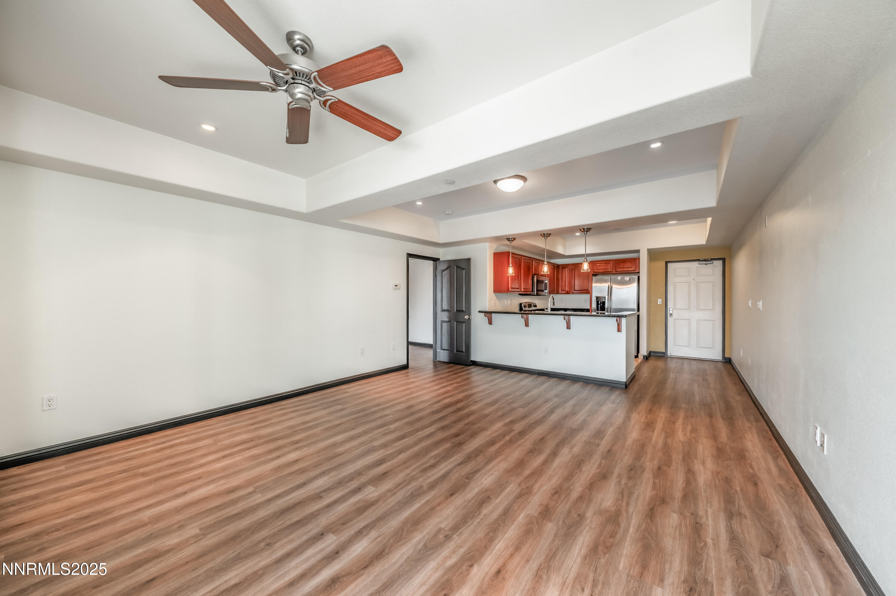 200 West 2nd Street, Unit 1101 Reno, NV 89501 - Photo 9 of 38 wooden floor in an empty room with a window