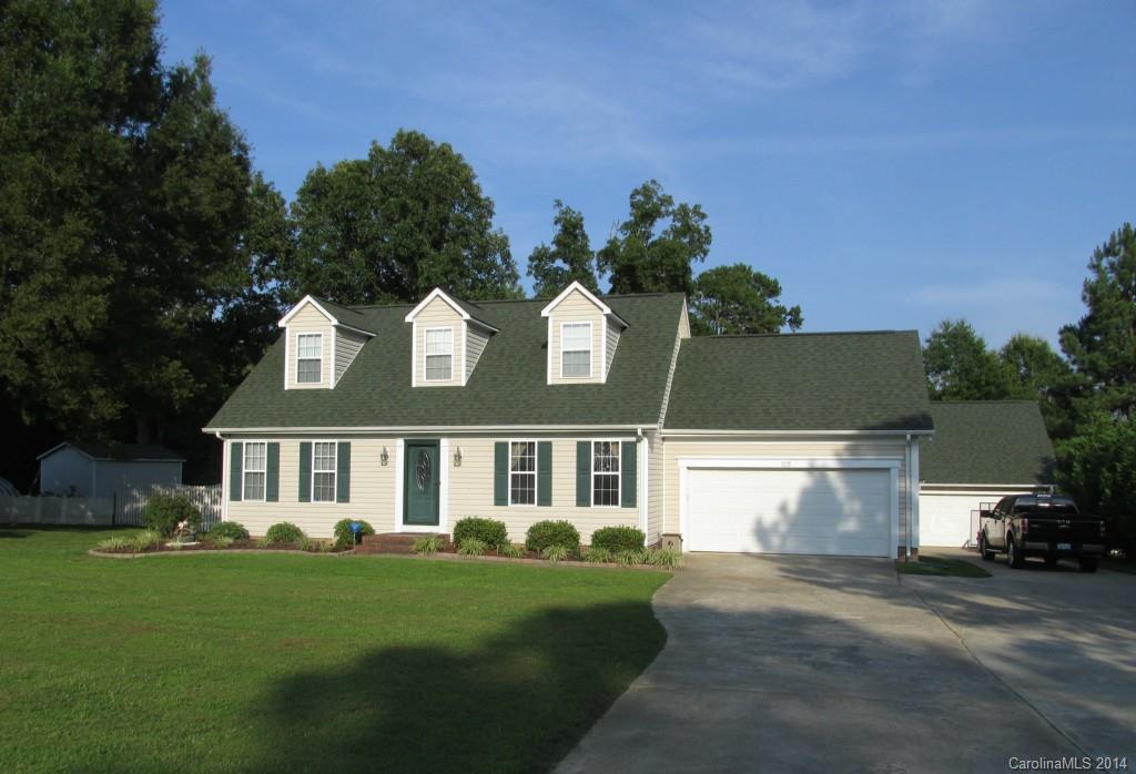 front view of a house with a garden