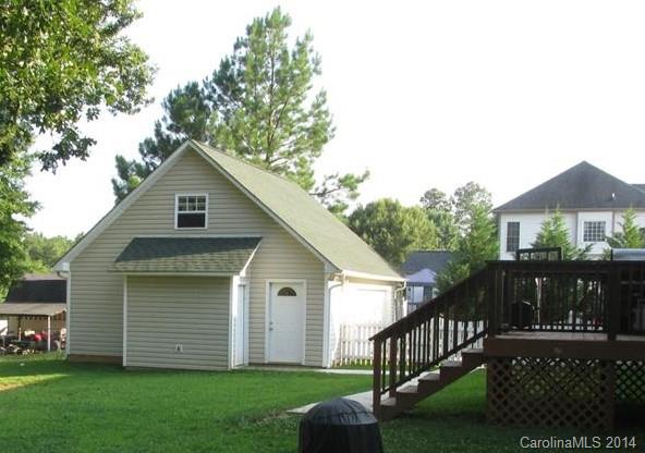 1115 Hess Road Concord, NC 28025 - Photo 2 of 21 a view of a house with a yard and a garden