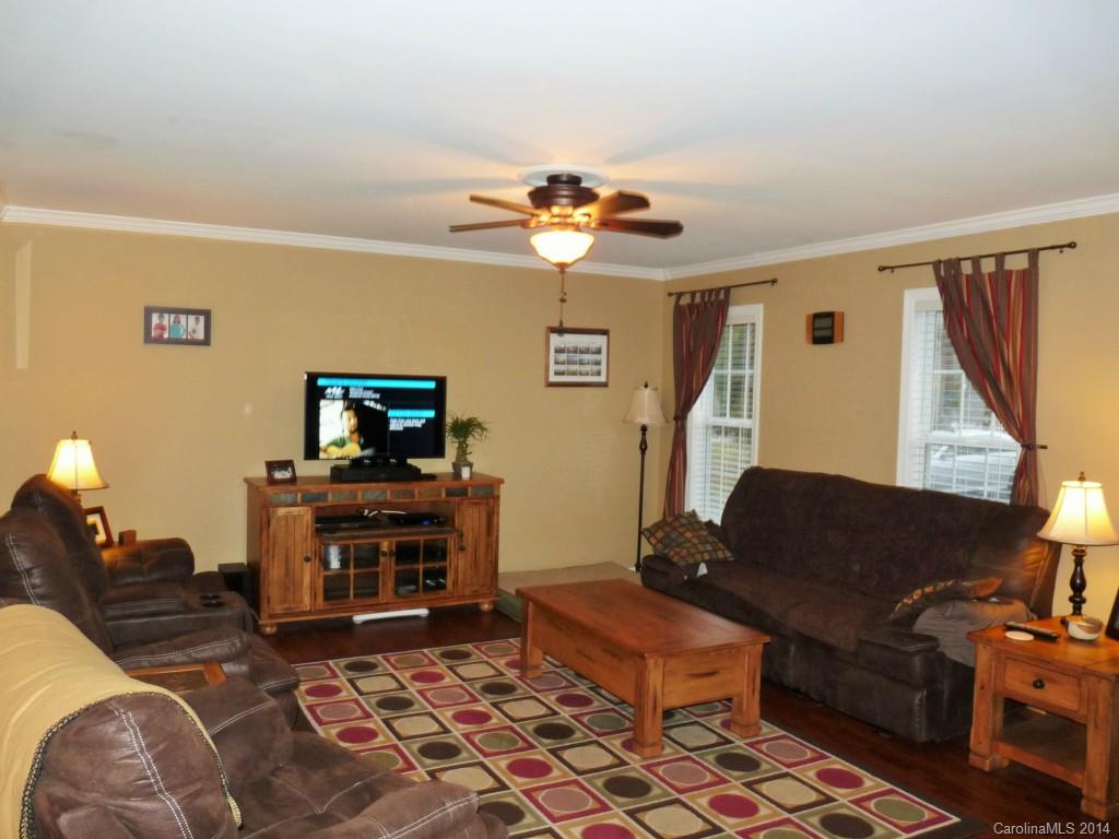 1115 Hess Road Concord, NC 28025 - Photo 12 of 21 a living room with furniture and a fireplace