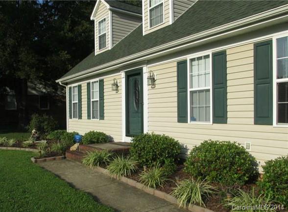 1115 Hess Road Concord, NC 28025 - Photo 18 of 21 a front view of a house with garden