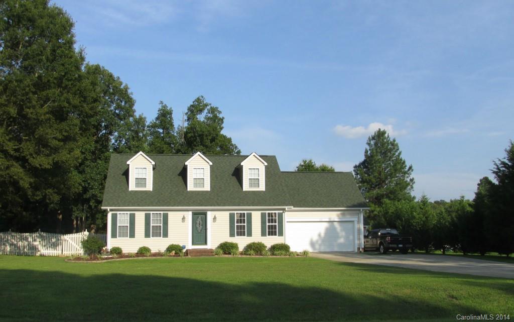1115 Hess Road Concord, NC 28025 - Photo 19 of 21 a front view of a house with a yard and trees