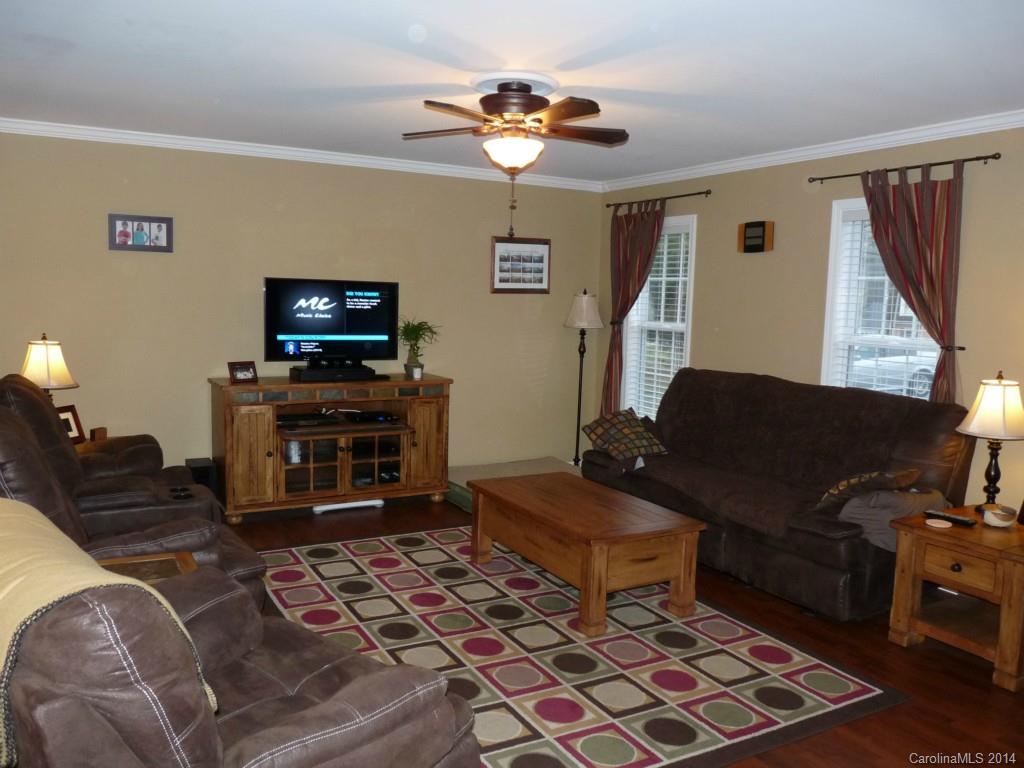 1115 Hess Road Concord, NC 28025 - Photo 4 of 21 a living room with furniture and a flat screen tv